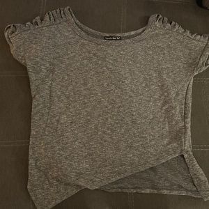 Grey tee with slit sleeves.